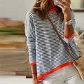 JO | Blue striped sweater with orange trim